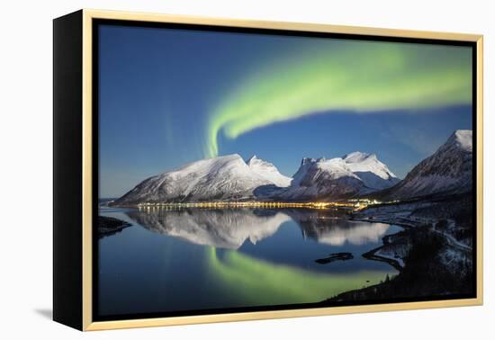 Northern lights and stars light up the snowy peaks reflected in sea, Bergsbotn, Senja, Norway-Roberto Moiola-Framed Premier Image Canvas