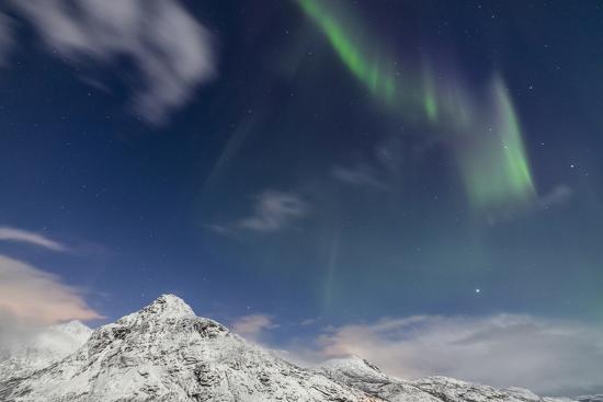 Northern Lights Aurora Borealis And Stars Light Up Snowy Peaks Vareid Flakstad North Norway Photographic Print By Roberto Moiola Art Com