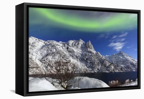 Northern Lights (Aurora Borealis) Illuminate the Snowy Peaks and the Blue Sky During a Starry Night-Roberto Moiola-Framed Premier Image Canvas