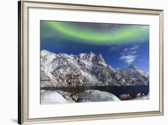 Northern Lights (Aurora Borealis) Illuminate the Snowy Peaks and the Blue Sky During a Starry Night-Roberto Moiola-Framed Photographic Print