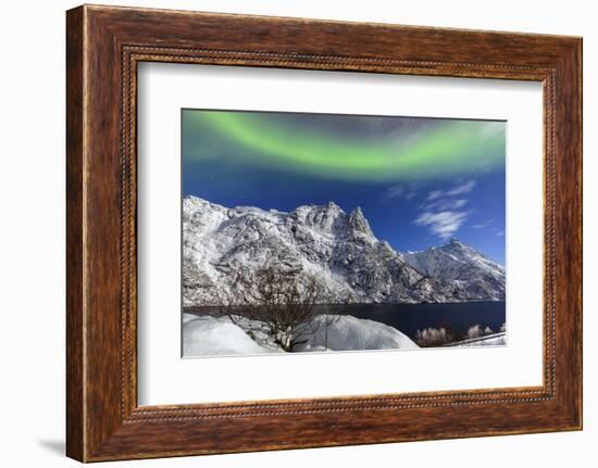 Northern Lights (Aurora Borealis) Illuminate the Snowy Peaks and the Blue Sky During a Starry Night-Roberto Moiola-Framed Photographic Print