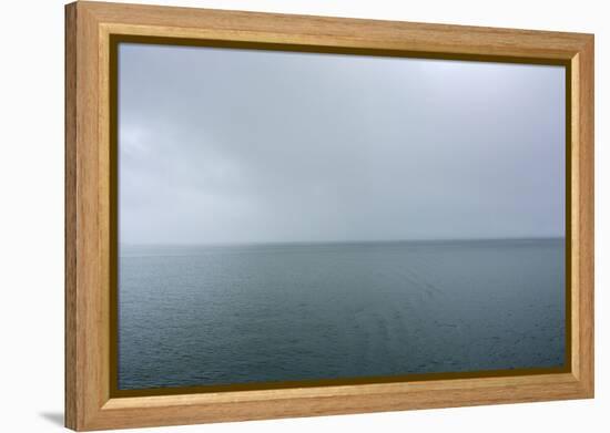 Norway. Svalbard. Hornsund. Heavy Clouds over the Calm Water-Inger Hogstrom-Framed Premier Image Canvas