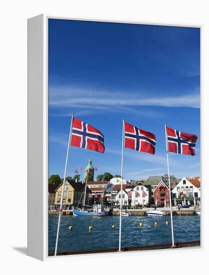 Norwegian Flags and Historic Harbour Warehouses, Stavanger, Norway, Scandinavia, Europe-Christian Kober-Framed Premier Image Canvas