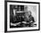 Novelist and Script Writer William Faulkner Smoking a Pipe at His Desk at Warner Brothers Studios-null-Framed Premium Photographic Print