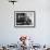 Novelist and Script Writer William Faulkner Smoking a Pipe at His Desk at Warner Brothers Studios-null-Framed Premium Photographic Print displayed on a wall