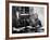 Novelist and Script Writer William Faulkner Smoking a Pipe at His Desk at Warner Brothers Studios-null-Framed Premium Photographic Print