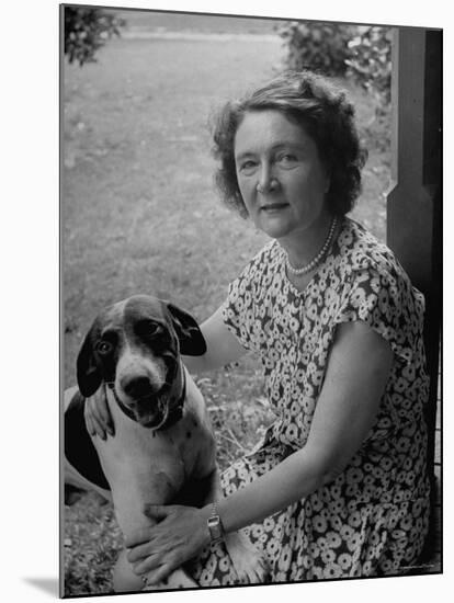 Novelist Marjorie K. Rawlings Petting Her Dog-Nina Leen-Mounted Premium Photographic Print
