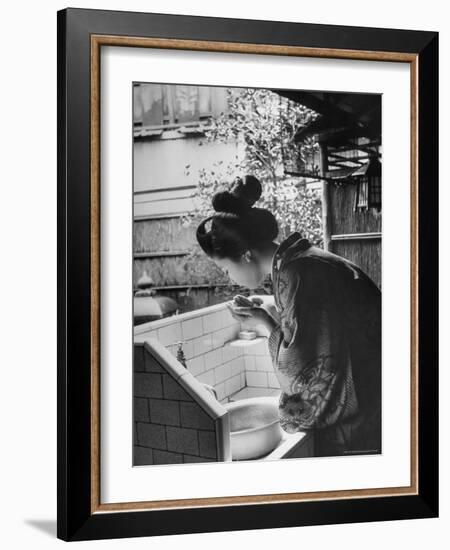 Novice Geisha Washing Her Face at a Basin-Alfred Eisenstaedt-Framed Photographic Print