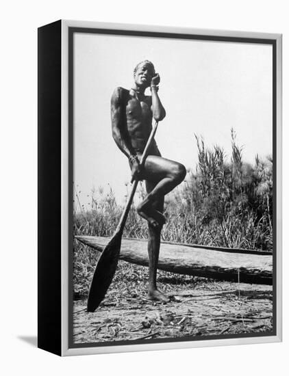 Nuer Tribesman Standing Like a Stork Next to His Canoe in a Papyrus Swamp-Eliot Elisofon-Framed Premier Image Canvas