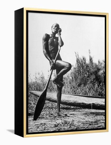 Nuer Tribesman Standing Like a Stork Next to His Canoe in a Papyrus Swamp-Eliot Elisofon-Framed Premier Image Canvas