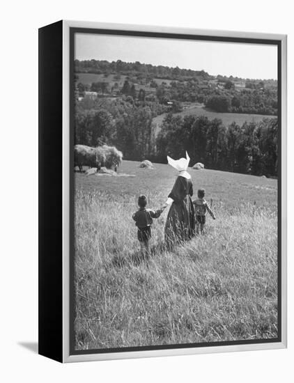 Nun Taking Two Young Children from the Mission on a Walk-null-Framed Premier Image Canvas