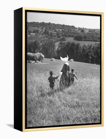 Nun Taking Two Young Children from the Mission on a Walk-null-Framed Premier Image Canvas