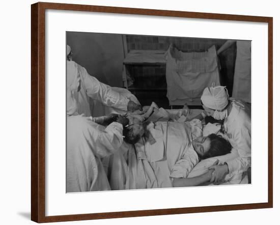 Nurse at Her Head and Holding Her Hands, as She Gazes at Her Baby Boy after "Painless" Childbirth-Alfred Eisenstaedt-Framed Premium Photographic Print