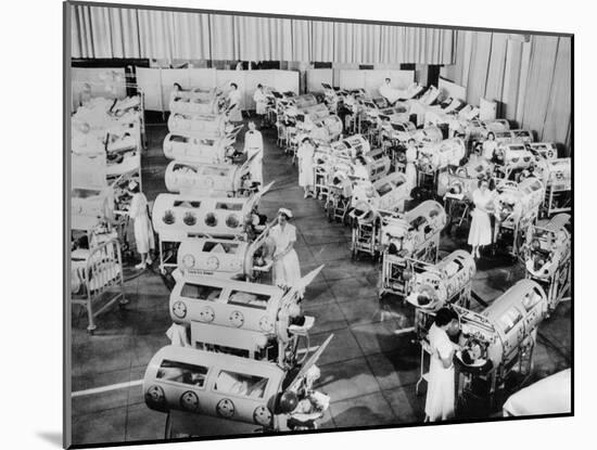 Nurse Attend to a Room Full of Polio Patients in Iron Lung Respirators-null-Mounted Photo