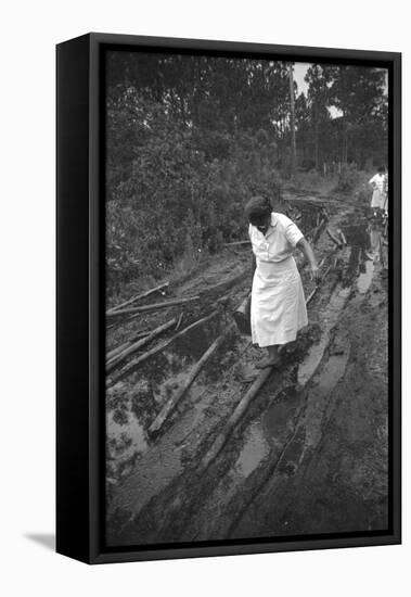 Nurse Maude Callen Carrying Her Medical Bag Along a Muddy Road after Caring for a Patient, 1951-W^ Eugene Smith-Framed Premier Image Canvas