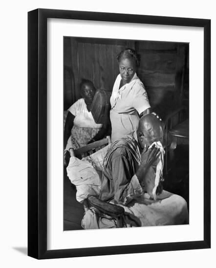 Nurse Midwife Maude Callen Tenderly Caring for an Old Chair-Bound Paralytic Touched by Her Kindness-W^ Eugene Smith-Framed Photographic Print