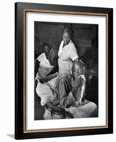Nurse Midwife Maude Callen Tenderly Caring for an Old Chair-Bound Paralytic Touched by Her Kindness-W^ Eugene Smith-Framed Photographic Print