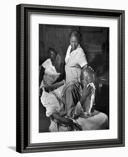 Nurse Midwife Maude Callen Tenderly Caring for an Old Chair-Bound Paralytic Touched by Her Kindness-W^ Eugene Smith-Framed Photographic Print