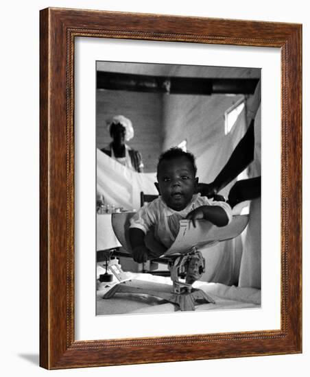 Nurse-Midwife Maude Callen Weighing Baby on Scale-W^ Eugene Smith-Framed Photographic Print