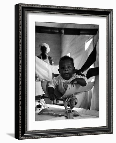 Nurse-Midwife Maude Callen Weighing Baby on Scale-W^ Eugene Smith-Framed Photographic Print