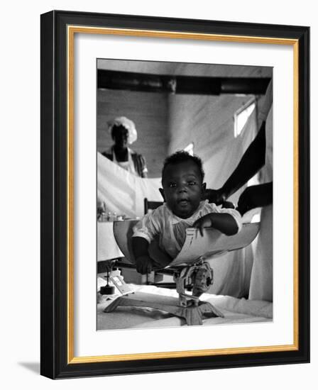 Nurse-Midwife Maude Callen Weighing Baby on Scale-W^ Eugene Smith-Framed Photographic Print