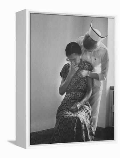 Nurse Trying to Comfort an Elderly Patient-Carl Mydans-Framed Premier Image Canvas