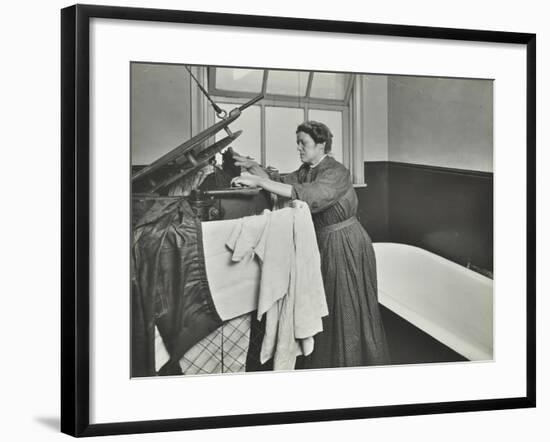 Nurse Using a Steriliser in the Bathroom at Chaucer Cleansing Station, London, 1911-null-Framed Photographic Print