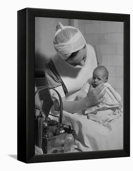 Nurse with Premature Baby-Hansel Mieth-Framed Premier Image Canvas