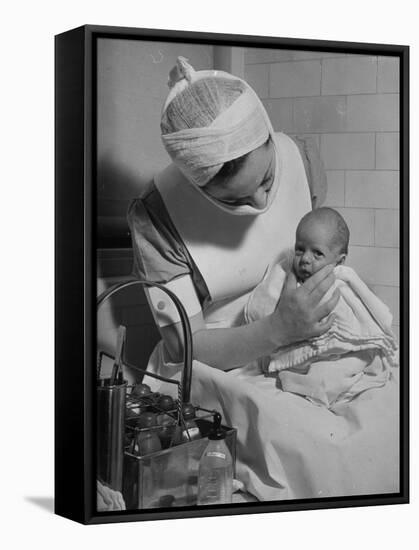 Nurse with Premature Baby-Hansel Mieth-Framed Premier Image Canvas