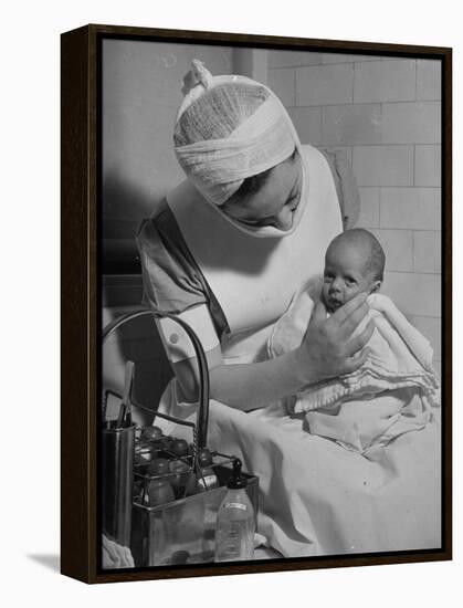 Nurse with Premature Baby-Hansel Mieth-Framed Premier Image Canvas