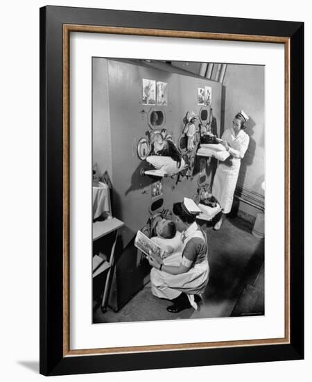 Nurses at Children's Hospital Tending Young Polio Patients Contained in Iron Lung Room-Hansel Mieth-Framed Photographic Print