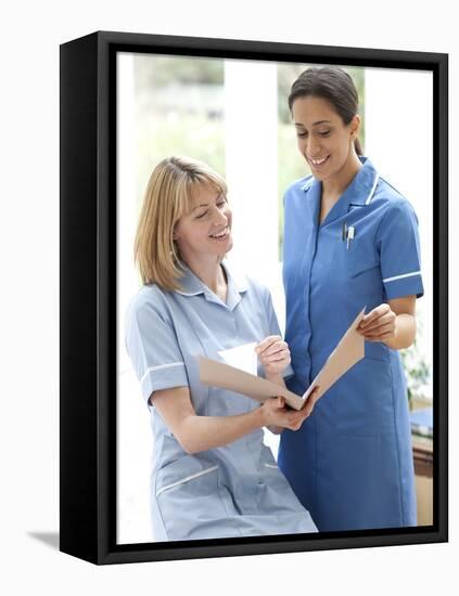 Nurses Checking Notes-Science Photo Library-Framed Premier Image Canvas