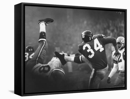 NY Giant Don Chandler Making a Punt in a Football Game Against the Green Bay Packers-John Loengard-Framed Premier Image Canvas