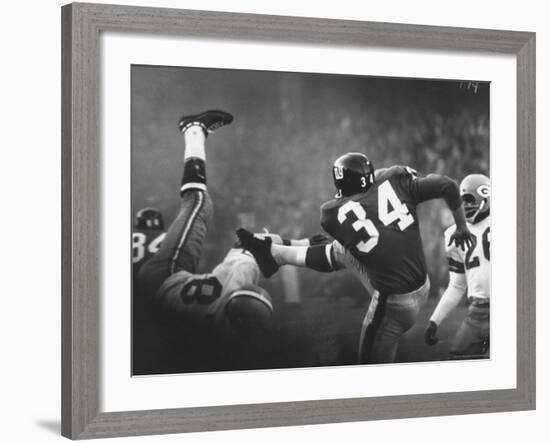 NY Giant Don Chandler Making a Punt in a Football Game Against the Green Bay Packers-John Loengard-Framed Premium Photographic Print