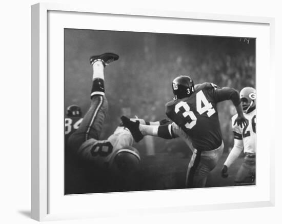 NY Giant Don Chandler Making a Punt in a Football Game Against the Green Bay Packers-John Loengard-Framed Premium Photographic Print