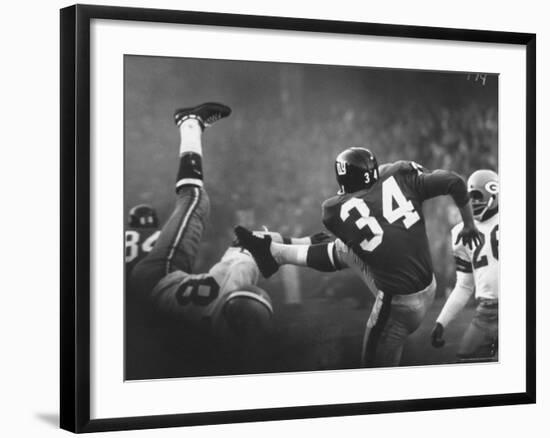 NY Giant Don Chandler Making a Punt in a Football Game Against the Green Bay Packers-John Loengard-Framed Premium Photographic Print