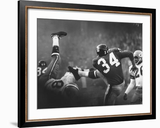 NY Giant Don Chandler Making a Punt in a Football Game Against the Green Bay Packers-John Loengard-Framed Premium Photographic Print