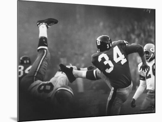 NY Giant Don Chandler Making a Punt in a Football Game Against the Green Bay Packers-John Loengard-Mounted Premium Photographic Print