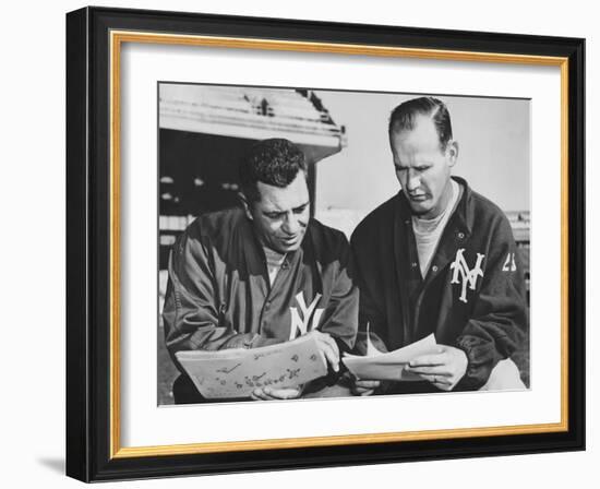 Ny Giants Coaches, Tom Landry and Vince Lombardi Reviewing Play Charts-null-Framed Photo