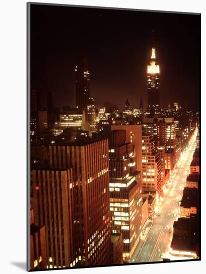 NYC Looking Down Sixth Avenue with Lights After Blackout with Empire State Building in Background-Ralph Morse-Mounted Photographic Print