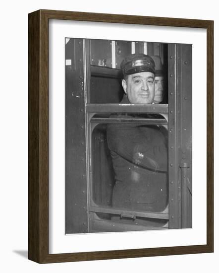 Nyc Mayor Fiorello Laguardia Wearing Motorman's Cap and Looking Out Window on Subway-null-Framed Photographic Print