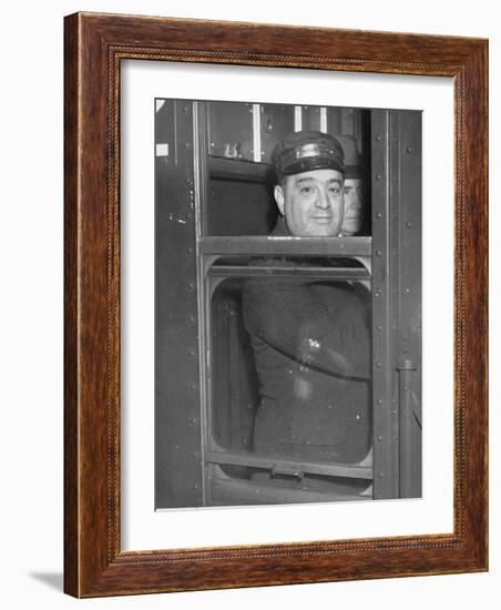 Nyc Mayor Fiorello Laguardia Wearing Motorman's Cap and Looking Out Window on Subway-null-Framed Photographic Print