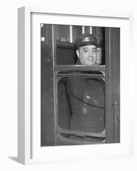 Nyc Mayor Fiorello Laguardia Wearing Motorman's Cap and Looking Out Window on Subway-null-Framed Photographic Print