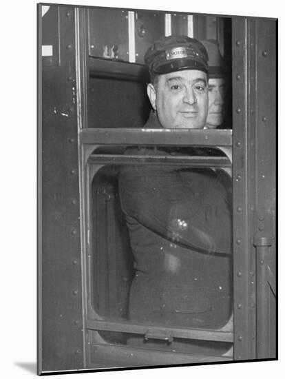 Nyc Mayor Fiorello Laguardia Wearing Motorman's Cap and Looking Out Window on Subway-null-Mounted Photographic Print