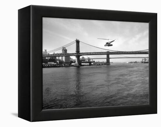 NYC Police Helicopter Hovering over the East River Next to the Manhattan Bridge-null-Framed Premier Image Canvas