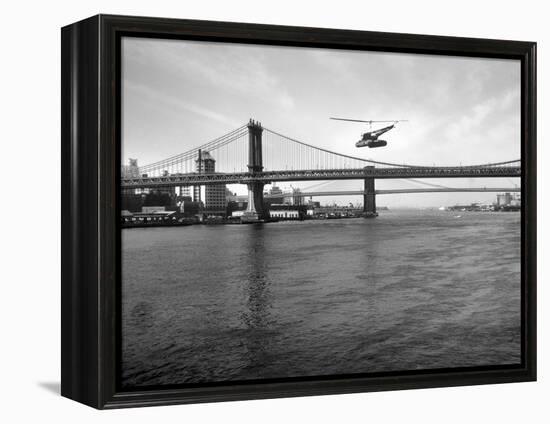 NYC Police Helicopter Hovering over the East River Next to the Manhattan Bridge-null-Framed Premier Image Canvas