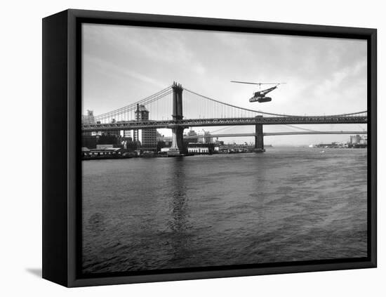 NYC Police Helicopter Hovering over the East River Next to the Manhattan Bridge-null-Framed Premier Image Canvas