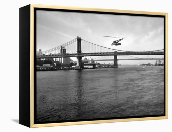 NYC Police Helicopter Hovering over the East River Next to the Manhattan Bridge-null-Framed Premier Image Canvas