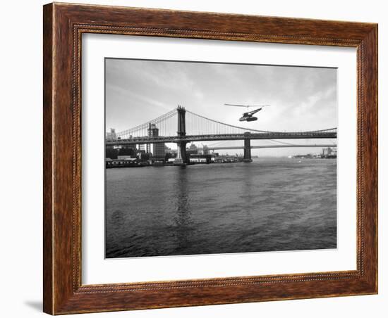 NYC Police Helicopter Hovering over the East River Next to the Manhattan Bridge-null-Framed Photographic Print