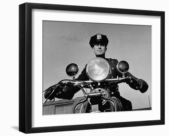 NYPD Motorcycle Cop Francis Kennedy Patrolling the Streets on His Bike-Carl Mydans-Framed Photographic Print